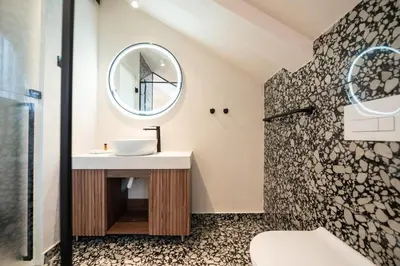 a bathroom with a sink and a mirror at Hotel Bohemian Garni - Skadarlija in Belgrade