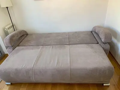 a bed in a room with a bed frame at Lazic Apartment in Belgrade