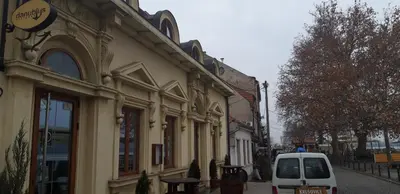 a white van parked in front of a building at Apartment Danubius in Belgrade