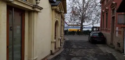 a car parked on a street between two buildings at Apartment Danubius in Belgrade