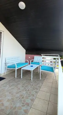 three blue and white benches in a room at Maslina Rooms in Smederevo
