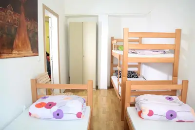 a room with two bunk beds and a hallway at Hostel Jellostone in Belgrade