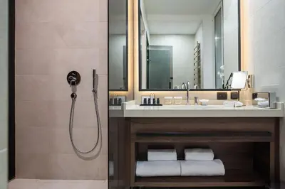 a bathroom with a shower and a sink at SAINT TEN Boutique Hotel, Small Luxury Hotels in Belgrade