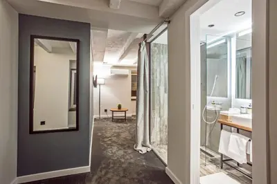 a bathroom with a sink and a mirror at Nomad Luxury Suites in Belgrade