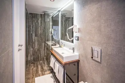 a bathroom with a sink and a mirror at Nomad Luxury Suites in Belgrade