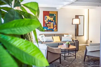 a living room with a couch and a table at Nomad Luxury Suites in Belgrade
