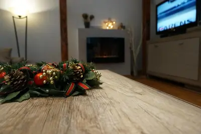 a christmas decoration on a table in a living room at Blue Danube Apartment in Belgrade