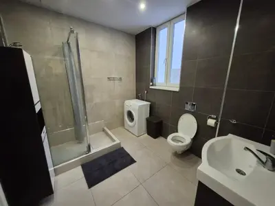 a bathroom with a shower toilet and a sink at Authentic Belgrade Centre Apartment #5, Four bedrooms, One Full Bathroom, One Toilet in Belgrade