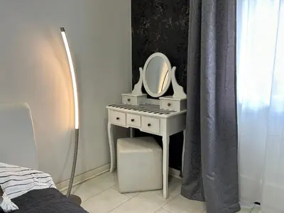 a bathroom with a sink and a mirror on a table at Princ Apartment in Belgrade
