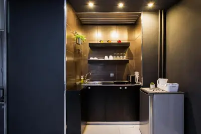a small kitchen with a sink and a counter at Princ Apartment in Belgrade