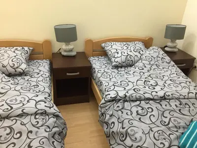 two beds sitting next to each other in a bedroom at AMN Center Apartment in Belgrade