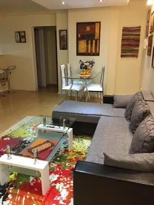 a living room with a couch and a table at AMN Center Apartment in Belgrade