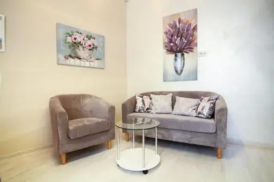 a living room with a couch and a chair at Savamala Lux Apartment in Belgrade