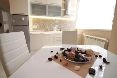 a bowl of food on a table in a kitchen at Savamala Lux Apartment in Belgrade