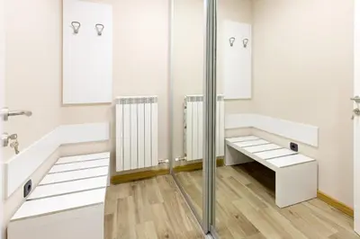 a bathroom with white walls and a shower stall at Hotel TESLA - Smart Stay Garni in Belgrade