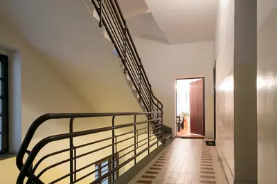 a staircase with a metal railing in a building at Urban Downtown Apartment in Belgrade
