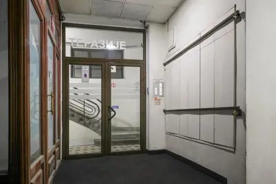 a door to a hallway with a sign that reads takemite at Urban Downtown Apartment in Belgrade