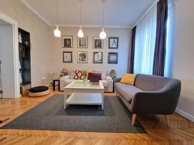 a living room with a couch and a table at Urban Downtown Apartment in Belgrade