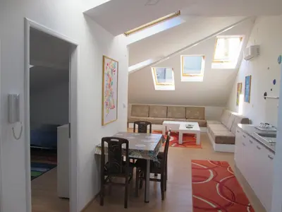 a living room with a table and a couch at Beograd Admiral Apartments in Belgrade