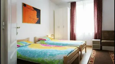 a bedroom with two beds and a window at Beograd Admiral Apartments in Belgrade