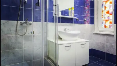 a bathroom with a sink and a shower at Beograd Admiral Apartments in Belgrade