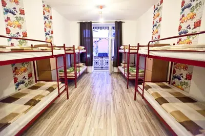a room with three bunk beds in it at Hostel 1910 in Belgrade