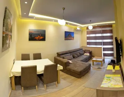 a living room with a couch and a table at 1A Moment Apartment in Belgrade