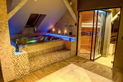 a large bathroom with a tub and a sink at Apartments Marconio Wellness Club in Belgrade