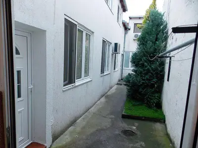 an alley with a christmas tree next to a building at Hostel Kavala in Belgrade
