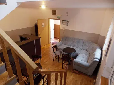 a living room with a couch and a table at Hostel Kavala in Belgrade