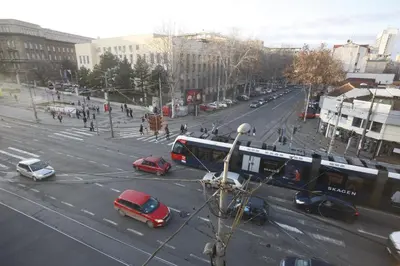 a busy city street with cars and a bus at TRAMVAJ Apartments in Belgrade