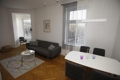 a living room with a couch and a table at TRAMVAJ Apartments in Belgrade