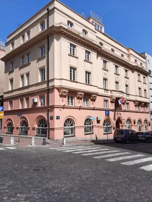 a large pink building on the side of a street at Petar Drapšin Hostel in Belgrade