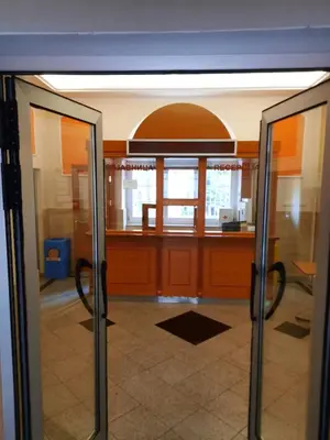 an open door of an office with a lobby at Petar Drapšin Hostel in Belgrade