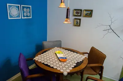 a room with a table with a toy on it at Apartmani15 in Arandjelovac