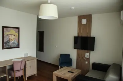a living room with a couch and a table at B&B Villa Panuka in Pančevo