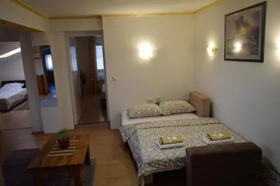 a small room with a bed and a table at Apartment Sleep'n Drive in Belgrade