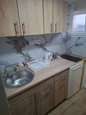 a kitchen with a sink and a counter top at Apartment Sleep'n Drive in Belgrade