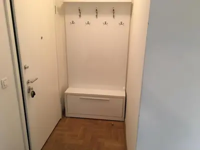 a room with a closet with a bench in it at Apartment Gorki in Belgrade