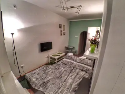 a living room with a couch and a flat screen tv at Sleep and Go Pedja in Belgrade
