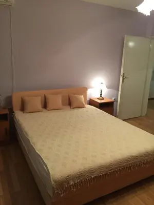 a bedroom with a large bed with two pillows on it at Villa Stella Smederevo in Smederevo