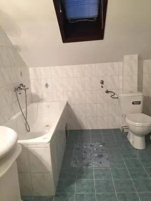 a bathroom with a tub and a toilet and a sink at Villa Stella Smederevo in Smederevo