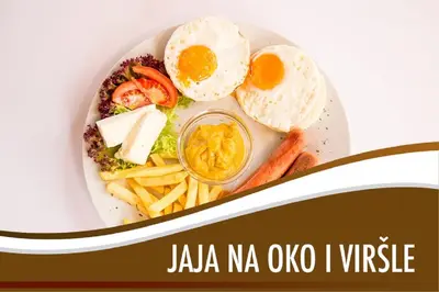 a plate of food with an egg and french fries at Apartment Skadarlija FREE parking in Belgrade