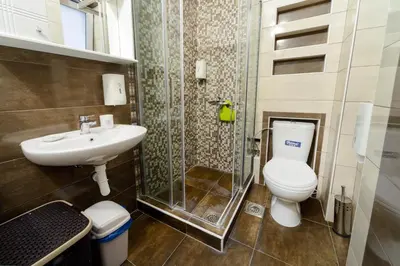 a bathroom with a toilet and a sink at Parliament Apartment in Belgrade