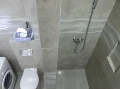 a bathroom with a shower stall with a toilet at Apartment River Walk in Belgrade