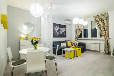 a living room with a table and a couch at Bohemian Quarter Apartment -1 Min to Skadarlija - Walk Everywhere in Belgrade