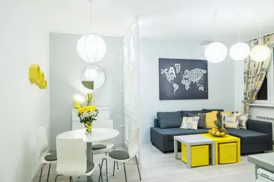 a living room with a couch and a table at Bohemian Quarter Apartment -1 Min to Skadarlija - Walk Everywhere in Belgrade
