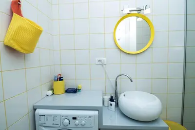 a bathroom with a sink and a washing machine at Bohemian Quarter Apartment -1 Min to Skadarlija - Walk Everywhere in Belgrade