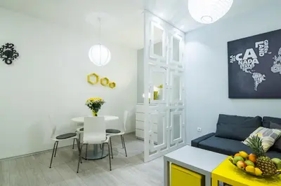 a living room with a couch and a table at Bohemian Quarter Apartment -1 Min to Skadarlija - Walk Everywhere in Belgrade