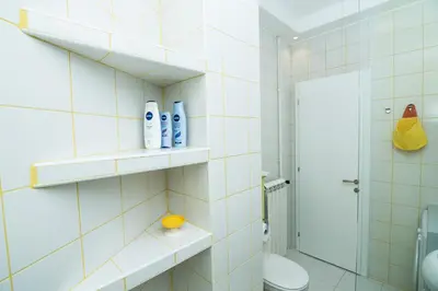 a bathroom with a toilet and a shower at Bohemian Quarter Apartment -1 Min to Skadarlija - Walk Everywhere in Belgrade